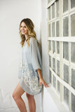Elegant floral stitch smoke kimono with a one-size-fits-most design.